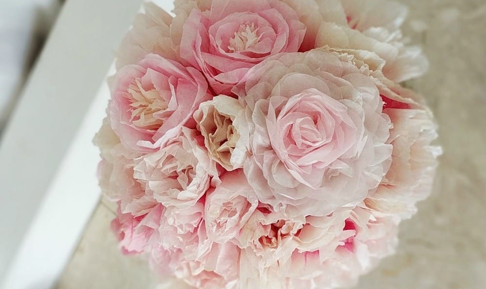 varied size ruffles made up the pink and cream tissue roses