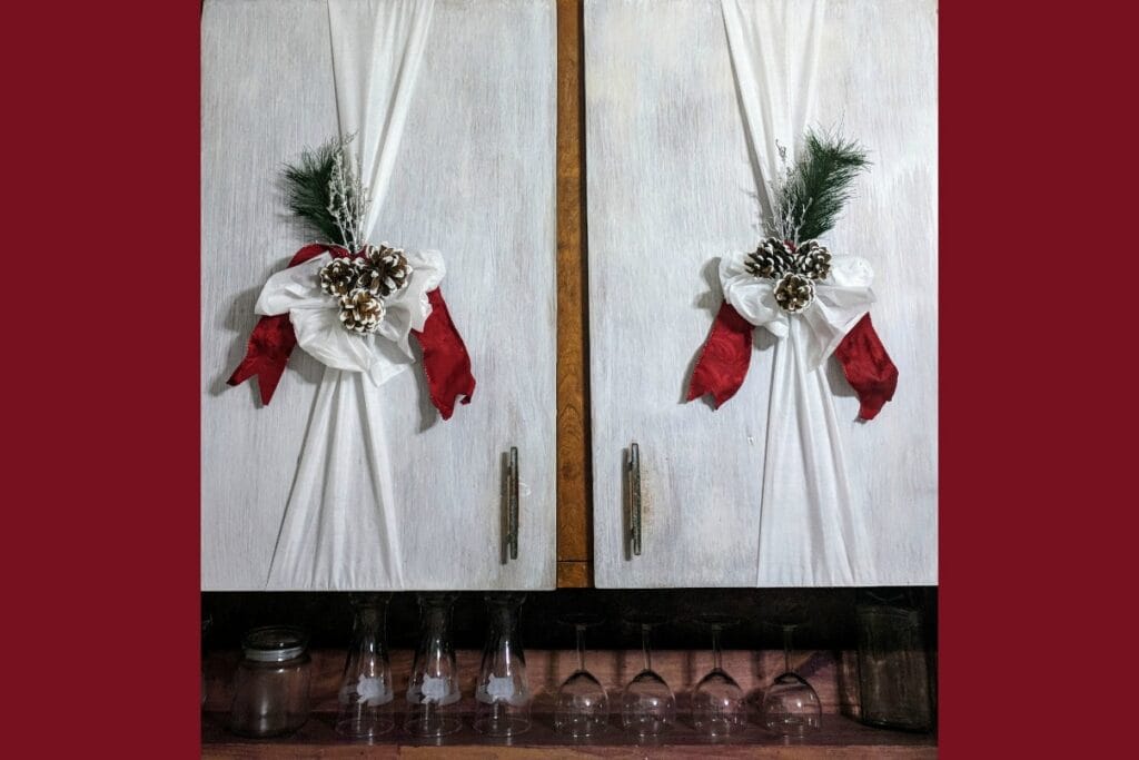 red Christmas decorations on the kitchen cupboard doors