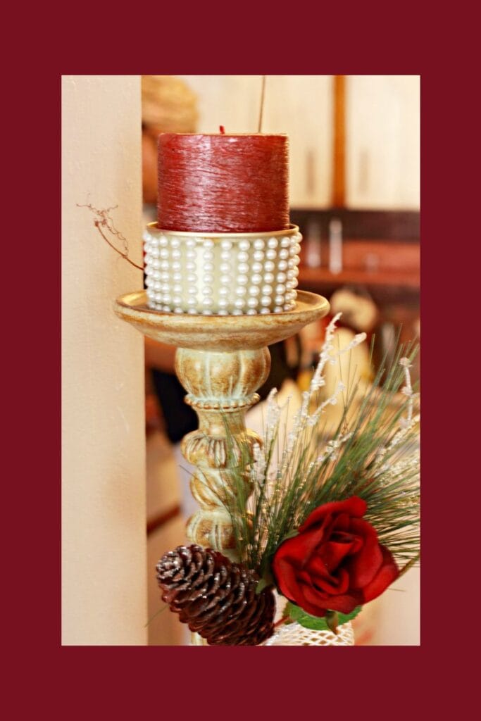 red Christmas decorations with a pearl studded tuna can candle holder